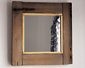 Mirror frame of viewfinder from door of cottage